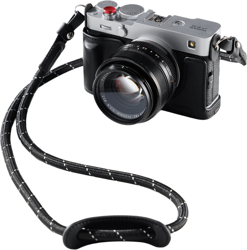 Designed to provide comprehensive protection while enhancing the camera's vintage appeal. This kit includes a half case and a shoulder strap