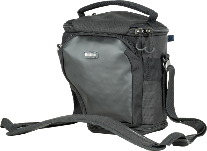 Unique holster developed specifically for a larger compact body with a 24-70mm f/4 attached with the hood reversed. Popped-down